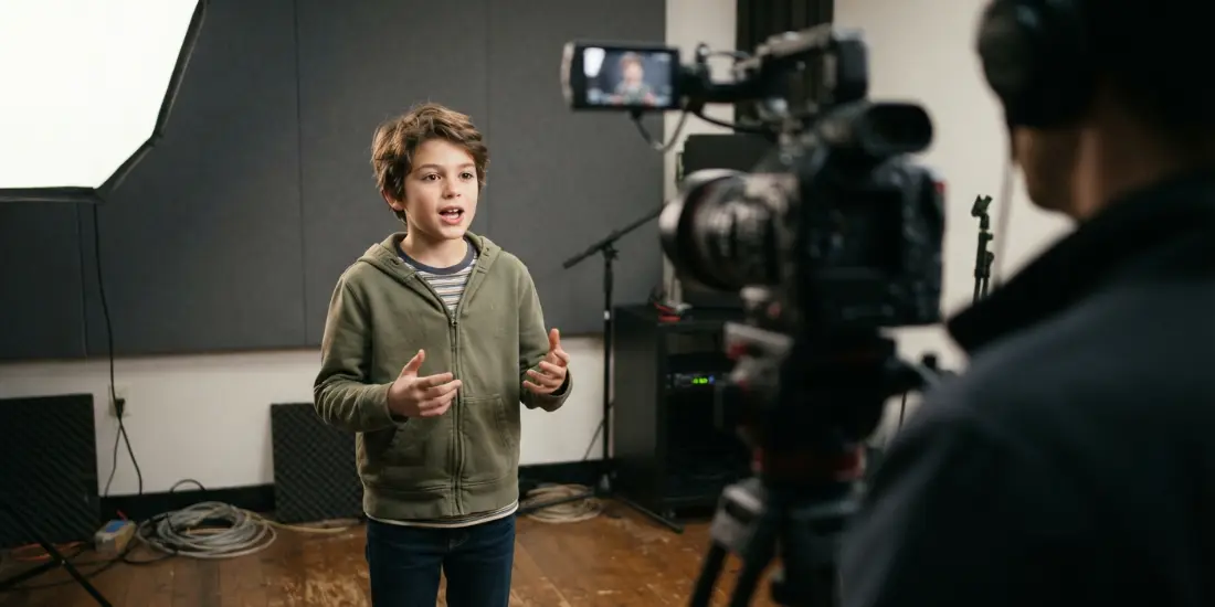 Acting class for kids in Austin — a young actor taking a note between takes