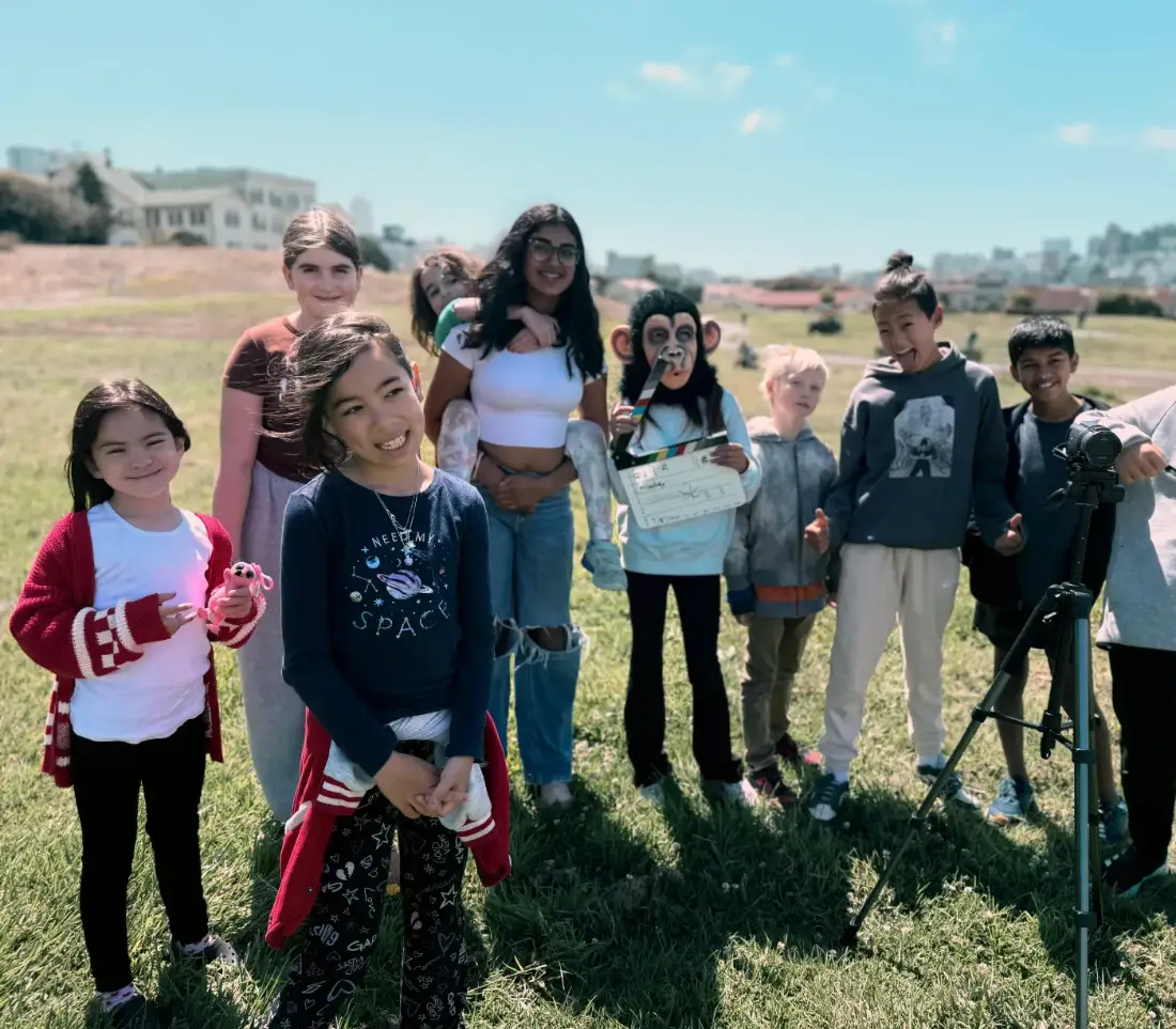 Filmmaking camp for kids — a San Francisco film camp crew with their slate and camera on location