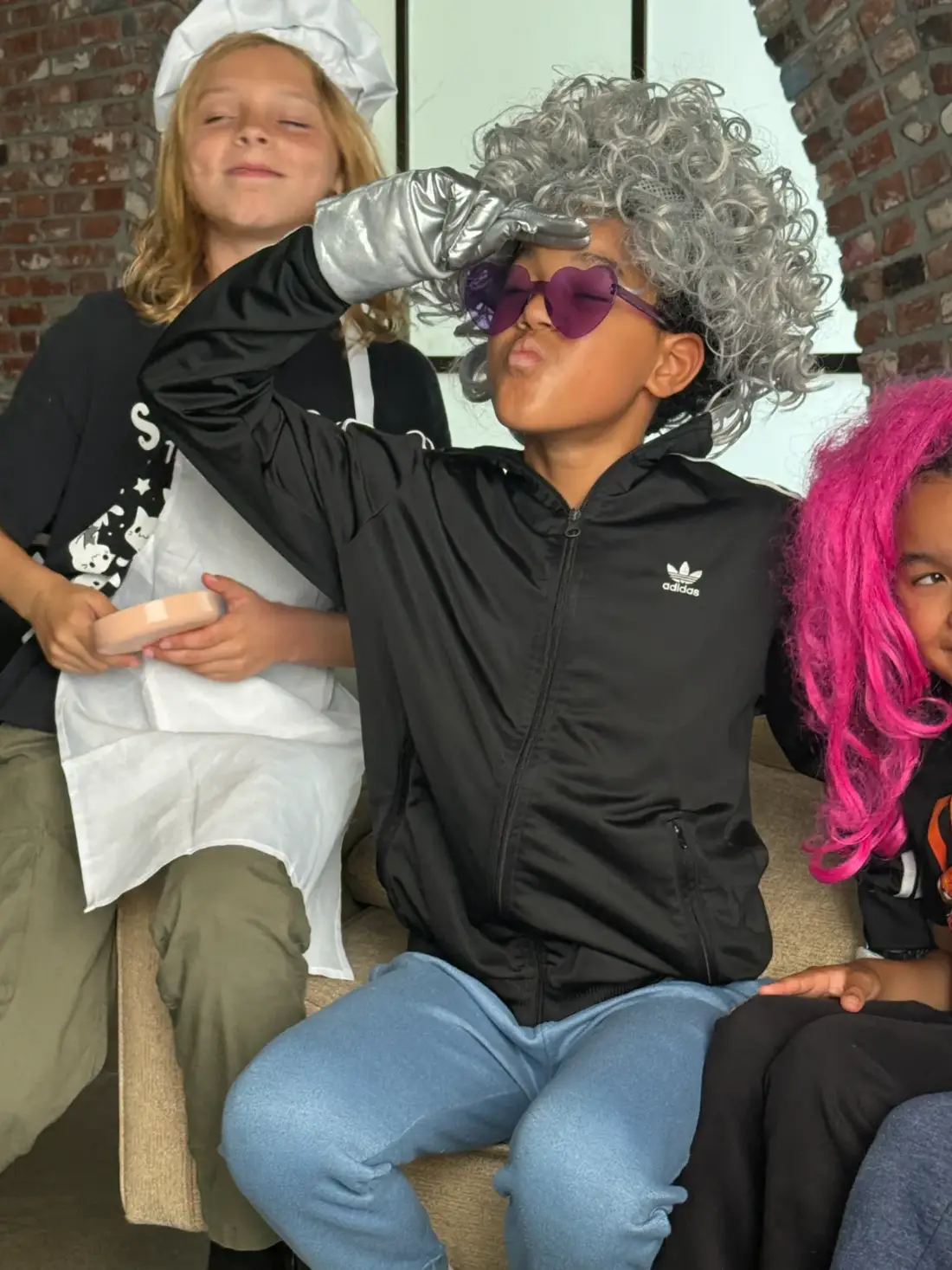 Campers in wigs and costume waiting for their scene