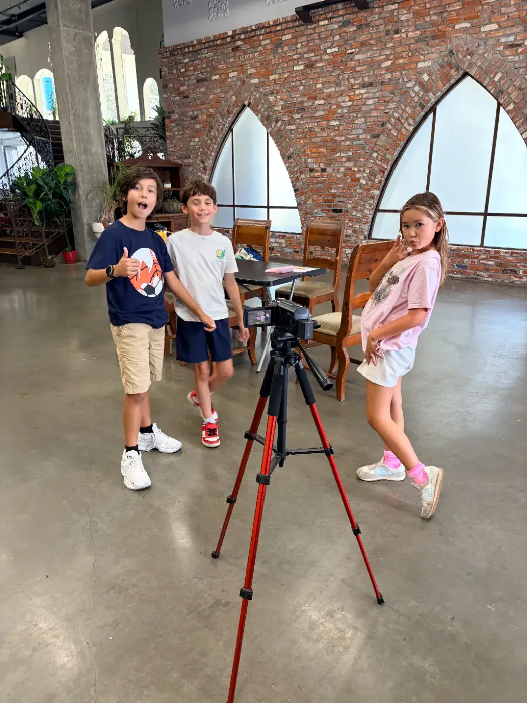 Three campers goofing for the camera on set between takes